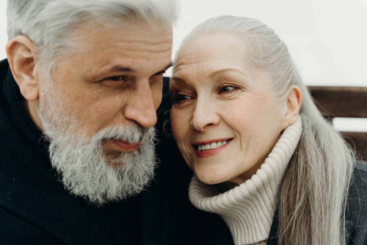 Happy senior couple discussing full mouth reconstruction in Mesa, AZ
