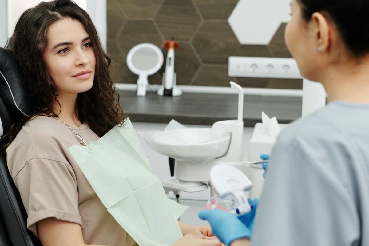 Patient discussing Invisalign clear aligners at a Mesa, AZ dental office