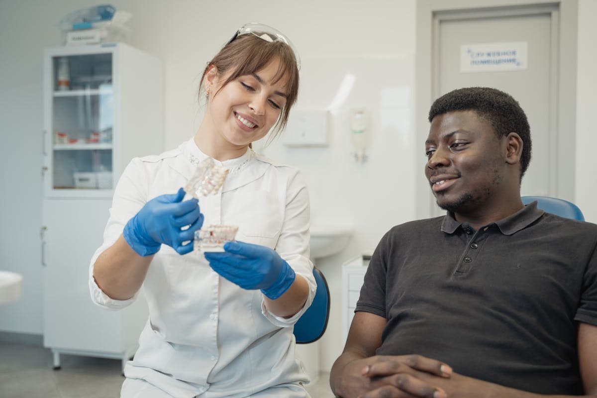 Dentist consulting a patient to prepare for full mouth dental implants in Mesa, AZ