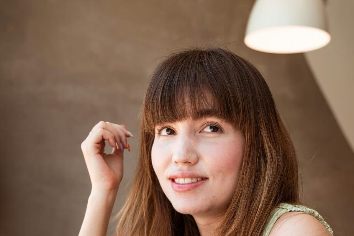 Woman with a bright smile after teeth whitening in Mesa, AZ