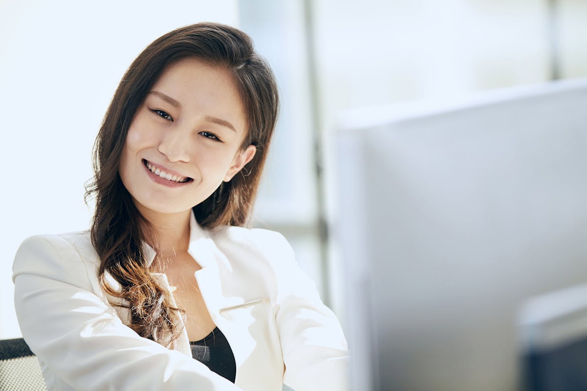 Confident woman considering dental implants vs dentures in Mesa, AZ
